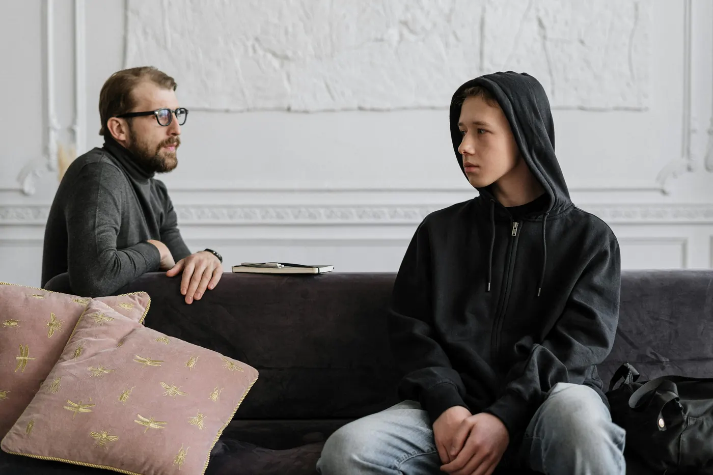 A teen talking with a counselor
